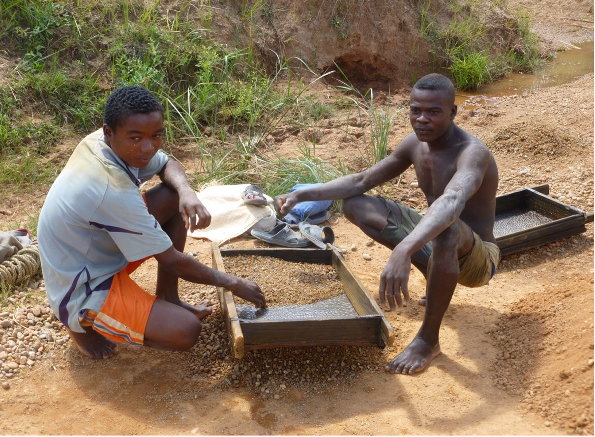 Sieving-gravels- Sieving gravels to reveal and pick coloured gemstones from an alluvial deposit. (Photo courtesy of Swarovski.)